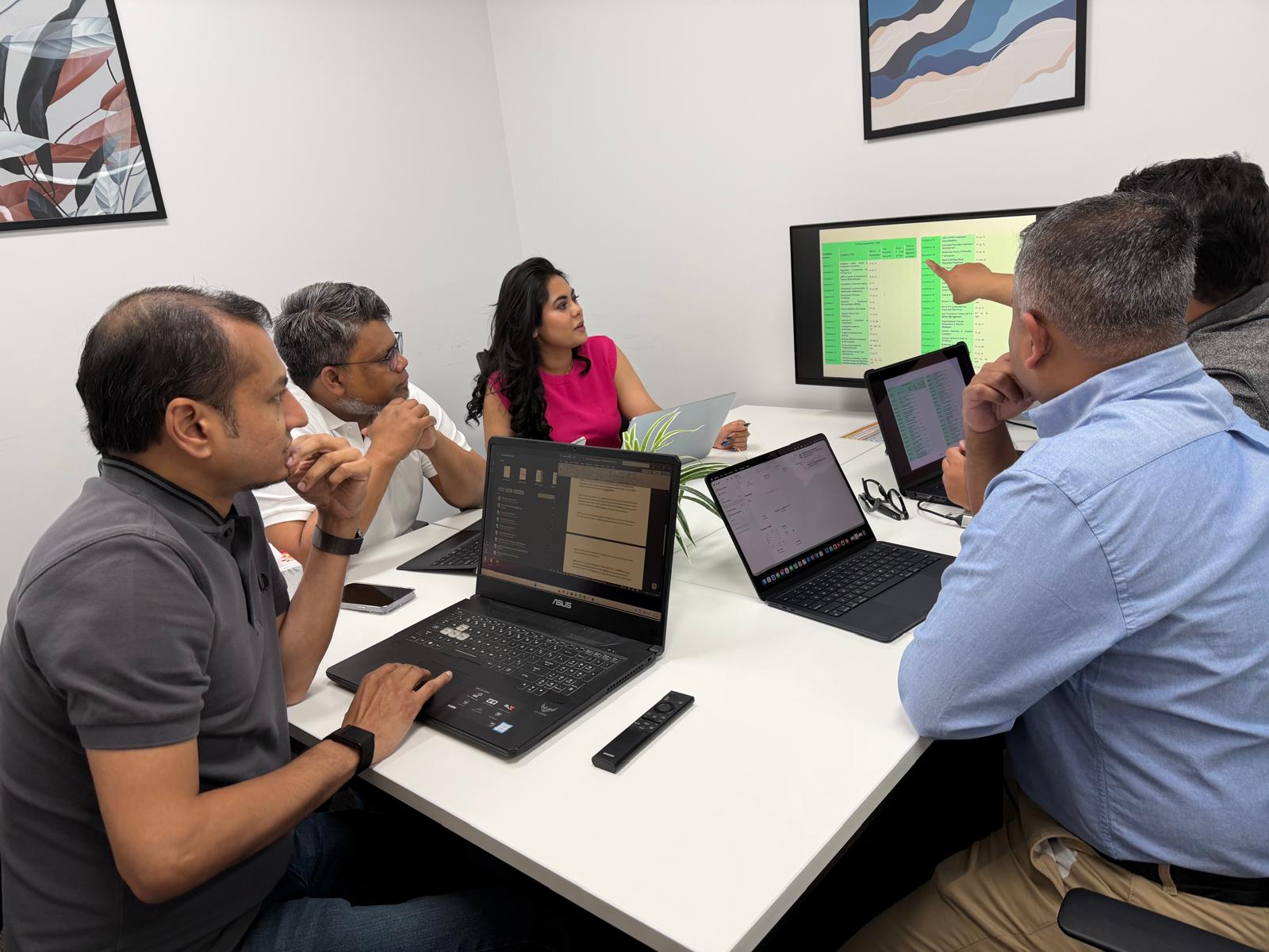 App AI team reviewing media information together